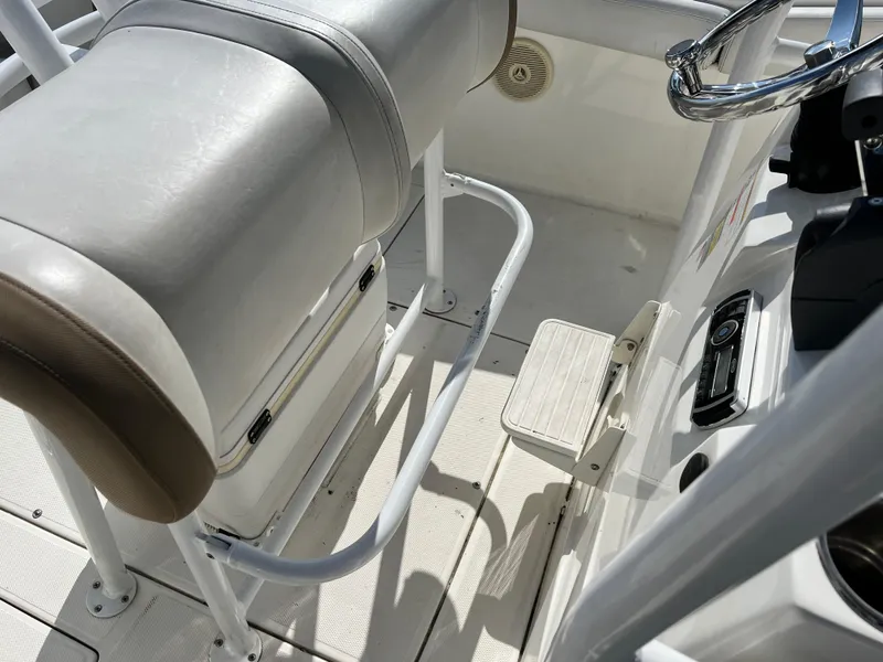 Slide: The Image of 2014 Striper 220 Center Console boat interior with seating and steering wheel. - 38