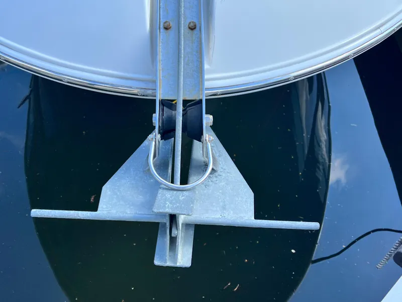 Slide: The Image of Bow of 2014 Striper 220 Center Console with anchor over water. - 49