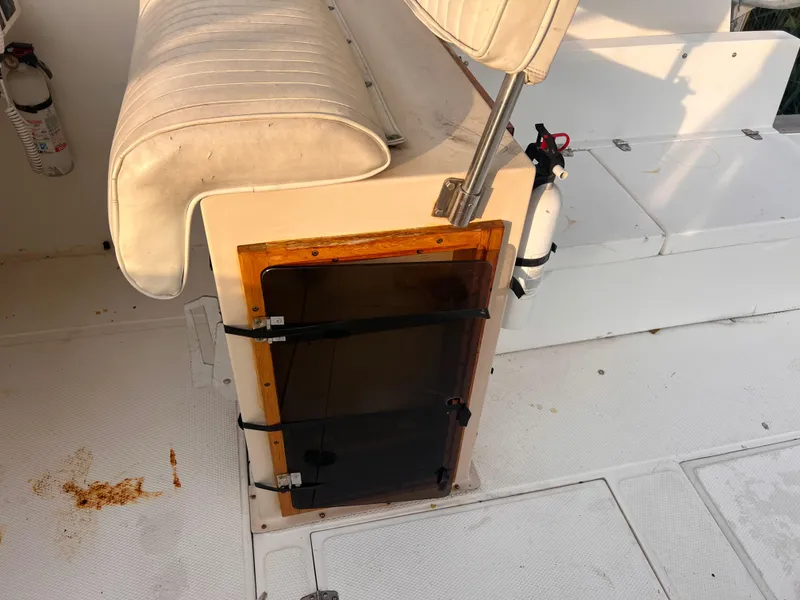 Slide: The Image of Canyon Bay 40 boat interior with seating and fire extinguisher, 1988 model. - 12