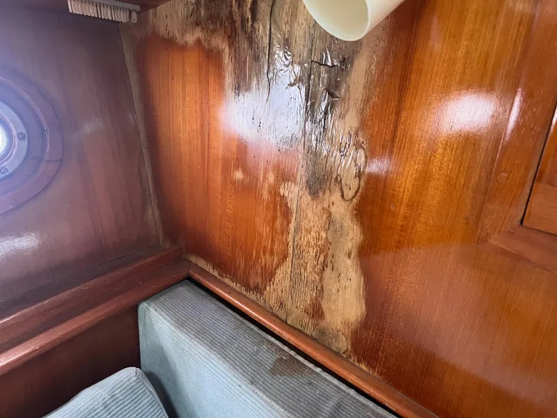 Slide: The Image of Water damage on wooden interior of 1988 Canyon Bay 40 boat cabin. - 40