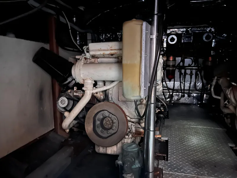 Slide: The Image of Engine room of a 1988 Canyon Bay 40 boat, showcasing mechanical components. - 41