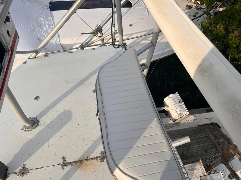 Slide: The Image of Top view of a 1988 Canyon Bay 40 boat deck with metal railings. - 47