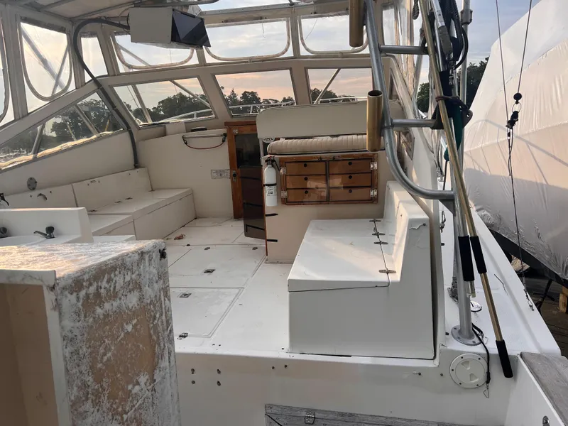 Slide: The Image of 1988 Canyon Bay 40 boat interior with seating and storage compartments. - 8