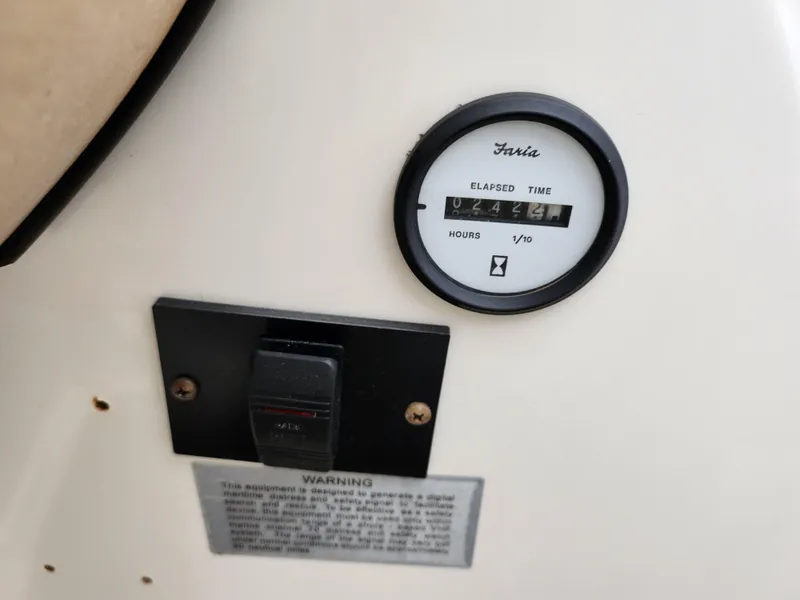 Slide: The Image of Hour meter on a 2008 Glastron GT 205 boat dashboard. - 14