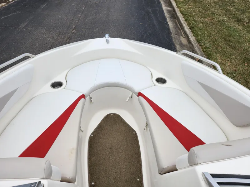 Slide: The Image of 2008 Glastron GT 205 boat bow seating area with red and white upholstery. - 17