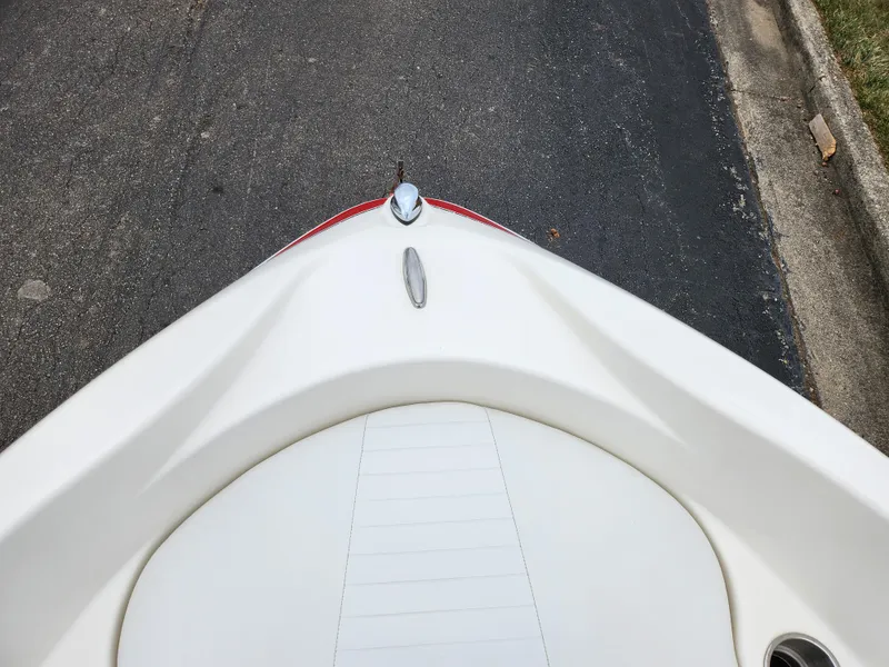 Slide: The Image of Bow of a 2008 Glastron GT 205 boat on pavement. - 18