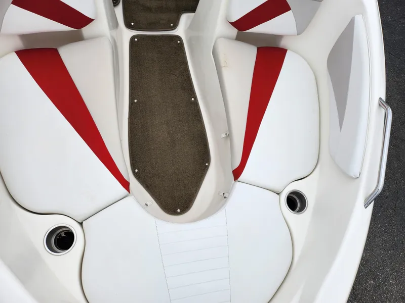 Slide: The Image of 2008 Glastron GT 205 boat interior with white and red seating. - 19