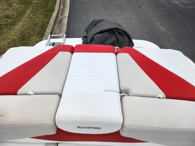 Slide: The Image of 2008 Glastron GT 205 boat with red and white seating. - 23