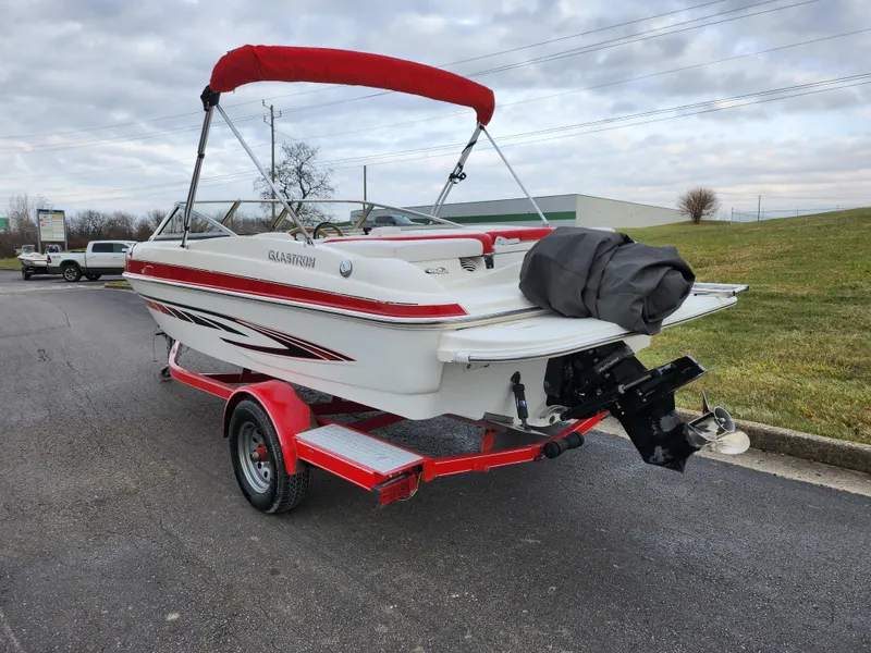 Slide: The Image of 2008 Glastron GT 205 boat with red trailer and canopy. - 3