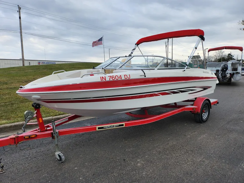 Slide: The Image of 2008 Glastron GT 205 boat on a red trailer with a red canopy. - 5