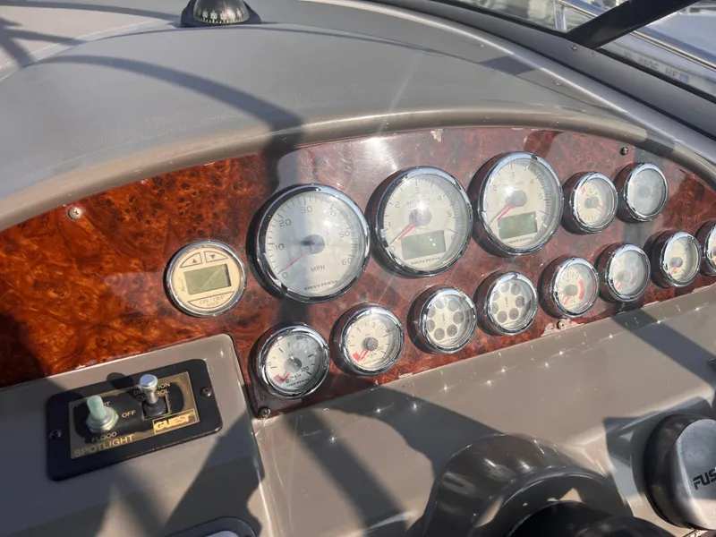 Slide: The Image of Dashboard of a 2011 Regal 35 Express Cruiser with gauges and controls. - 16