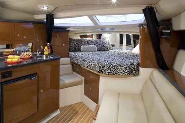 Slide: The Image of Luxurious interior of 2011 Regal 35 Express Cruiser with cozy bed and kitchenette. - 22