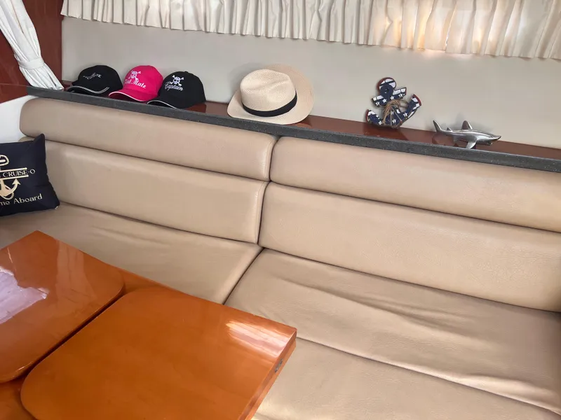 Slide: The Image of Interior of 2011 Regal 35 Express Cruiser with hats and nautical decor. - 28