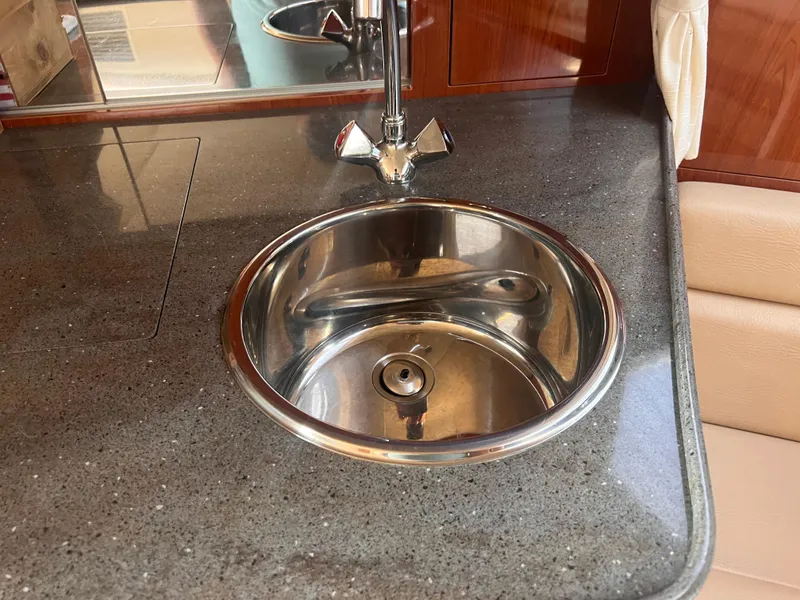 Slide: The Image of Stainless steel sink on 2011 Regal 35 Express Cruiser's sleek countertop. - 31