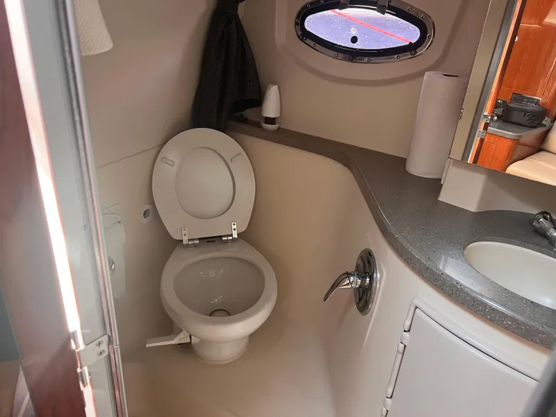 Slide: The Image of Bathroom interior of 2011 Regal 35 Express Cruiser with toilet and sink. - 37