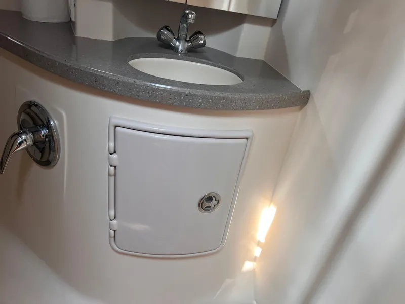 Slide: The Image of Bathroom sink area in a 2011 Regal 35 Express Cruiser yacht. - 38