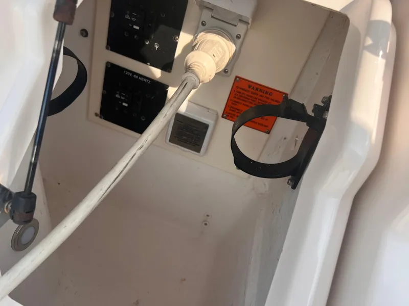 Slide: The Image of Electrical panel and wiring inside a 2011 Regal 35 Express Cruiser boat. - 39