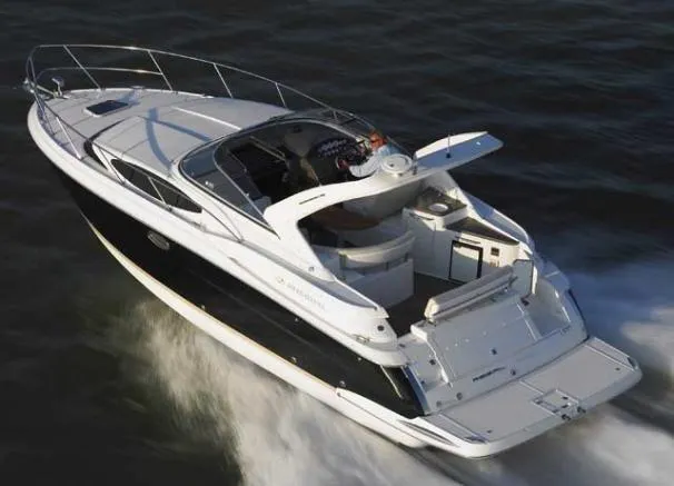Slide: The Image of 2011 Regal 35 Express Cruiser speeding on open water, showcasing sleek design and luxury features. - 45