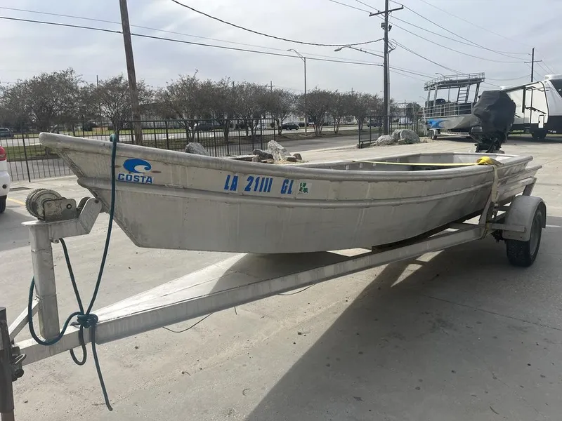 Slide: The Image of Custom 2020 Crawfish Skiff on trailer in parking lot. - 4