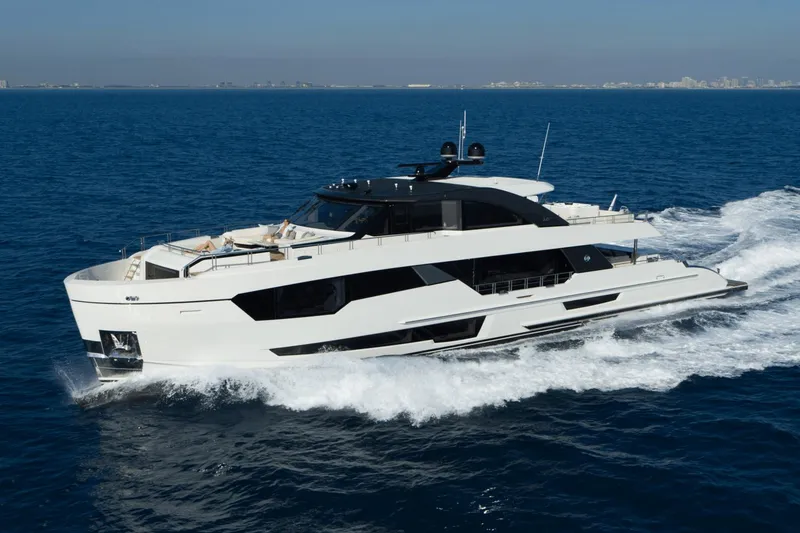 Slide: The Image of 2023 Ocean Alexander 32E luxury yacht cruising on open water. - 0