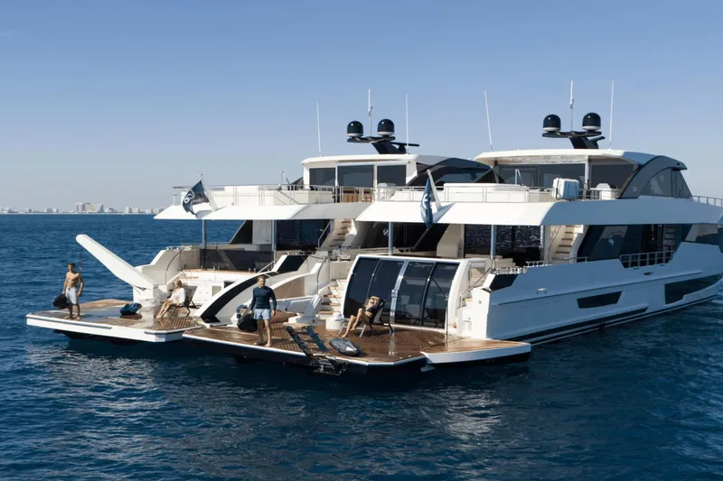 Slide: The Image of Luxury 2023 Ocean Alexander 32E yacht with people enjoying the deck on the open sea. - 13