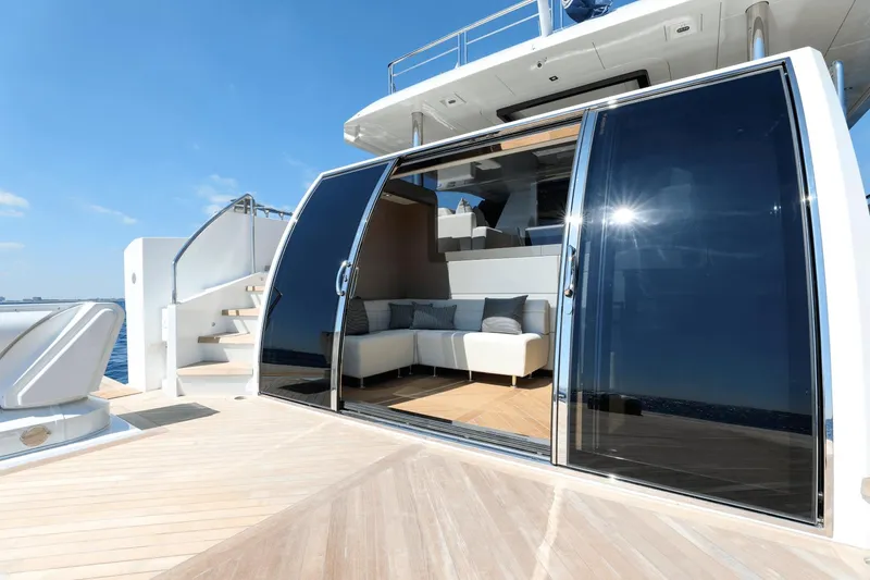 Slide: The Image of Luxury Ocean Alexander 32E yacht 2023 model with sliding glass doors and modern interior. - 16