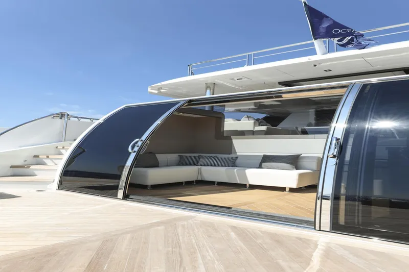 Slide: The Image of Ocean Alexander 32E 2023 yacht with open sliding doors and luxurious interior. - 17