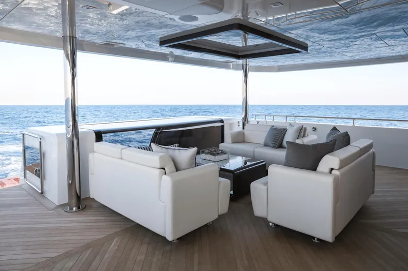 Slide: The Image of Luxurious Ocean Alexander 32E 2023 yacht with elegant outdoor seating area. - 18