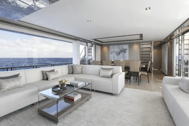 Slide: The Image of Luxurious interior of 2023 Ocean Alexander 32E yacht with ocean view, modern seating, and dining area. - 19