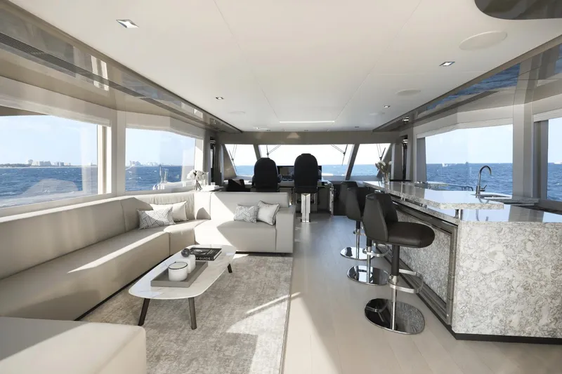 Slide: The Image of Luxurious interior of 2023 Ocean Alexander 32E yacht with modern seating and panoramic ocean views. - 32