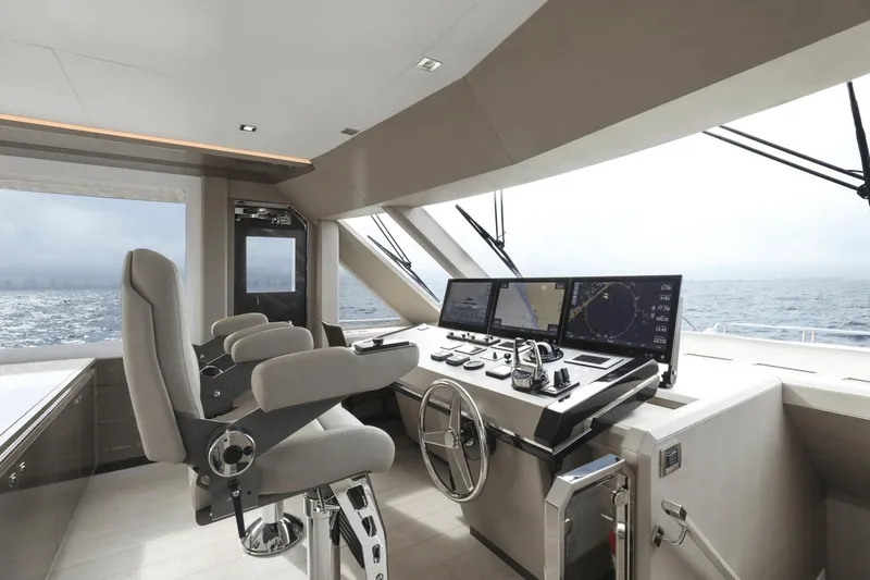 Slide: The Image of Modern helm station of 2023 Ocean Alexander 32E yacht with advanced navigation systems. - 34