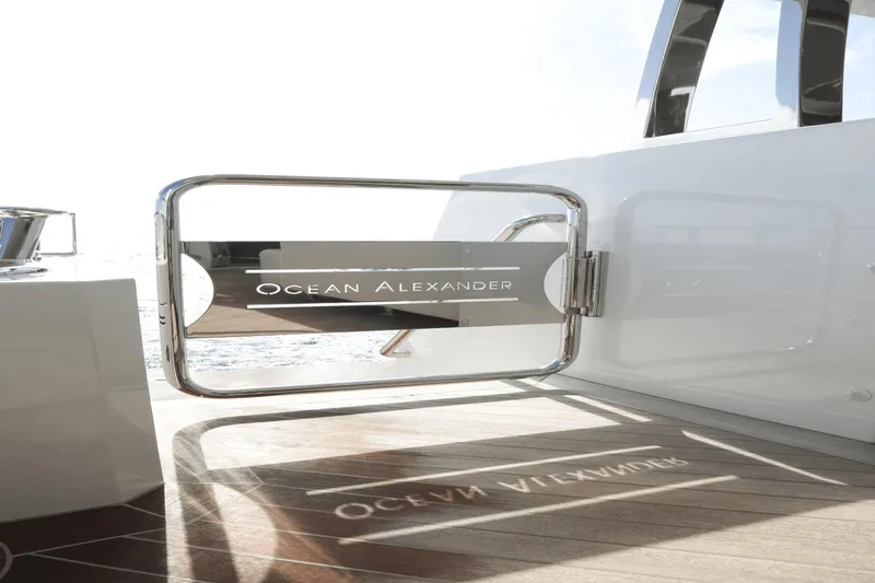 Slide: The Image of Ocean Alexander 32E 2023 yacht gate with logo, stainless steel and teak deck. - 41