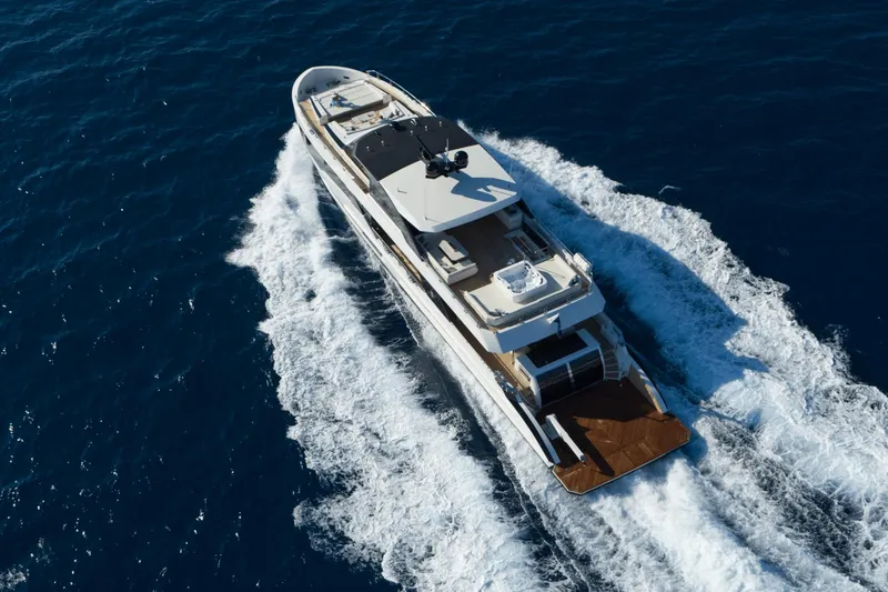 Slide: The Image of Aerial view of 2023 Ocean Alexander 32E yacht cruising on the ocean. - 7