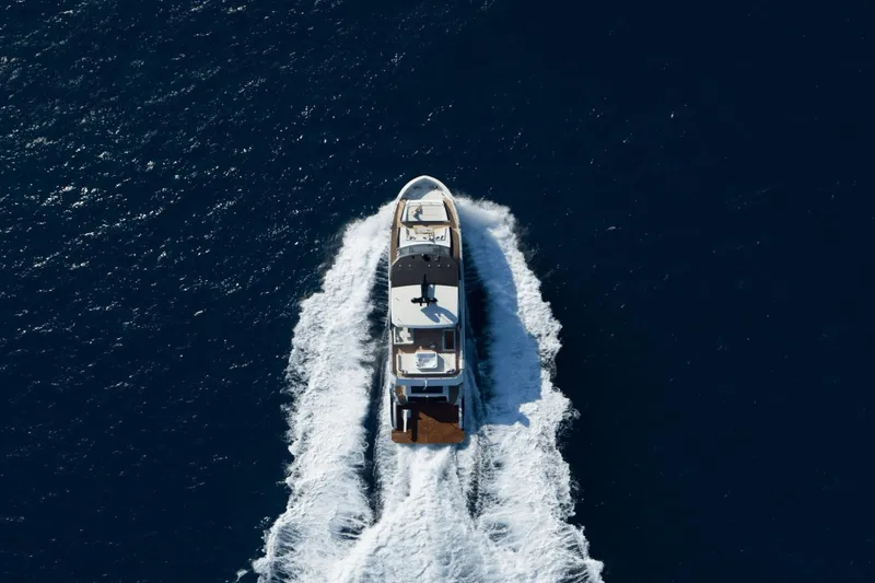 Slide: The Image of Aerial view of 2023 Ocean Alexander 32E yacht cruising on open water. - 8