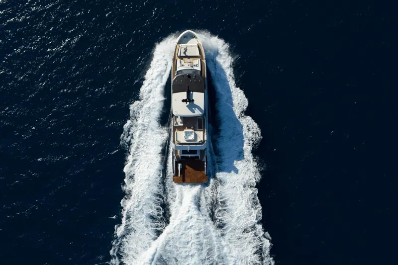 Slide: The Image of Aerial view of 2023 Ocean Alexander 32E yacht cruising on open water. - 9