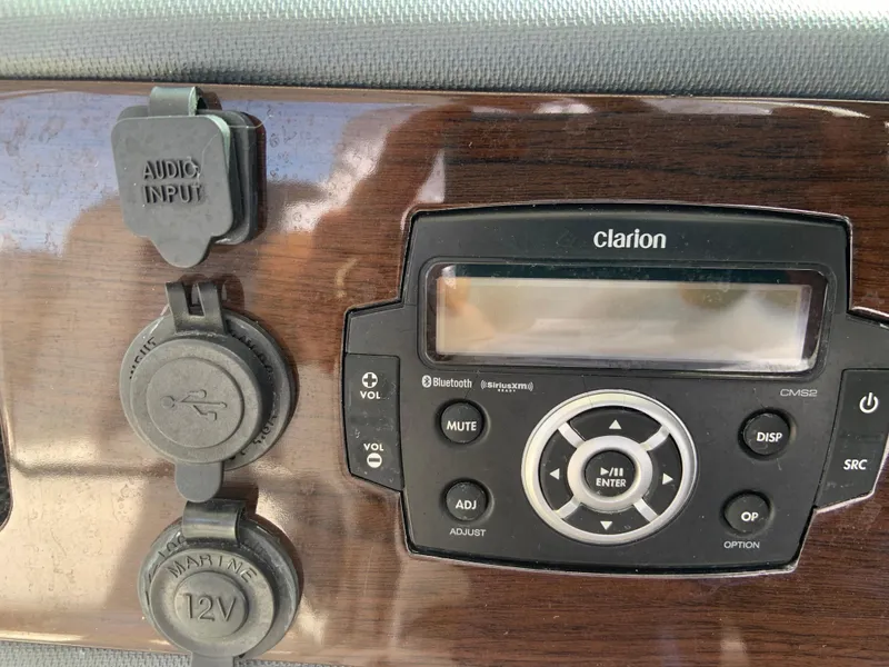 Slide: The Image of Clarion audio system on 2020 Chaparral 280 OSX boat dashboard. - 13