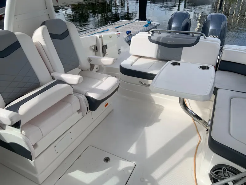 Slide: The Image of 2020 Chaparral 280 OSX boat interior with seating and table setup. - 15