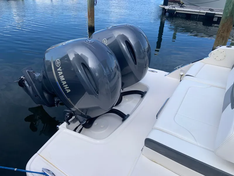 Slide: The Image of 2020 Chaparral 280 OSX with twin Yamaha outboard engines docked. - 19