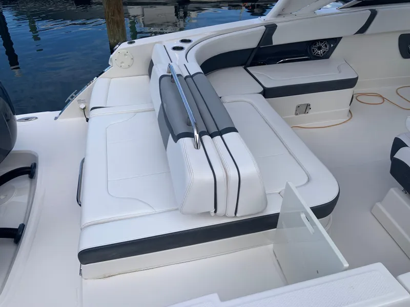Slide: The Image of 2020 Chaparral 280 OSX boat interior with white and gray seating. - 24