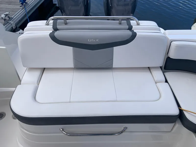 Slide: The Image of 2020 Chaparral 280 OSX boat with white and gray cushioned seating. - 25