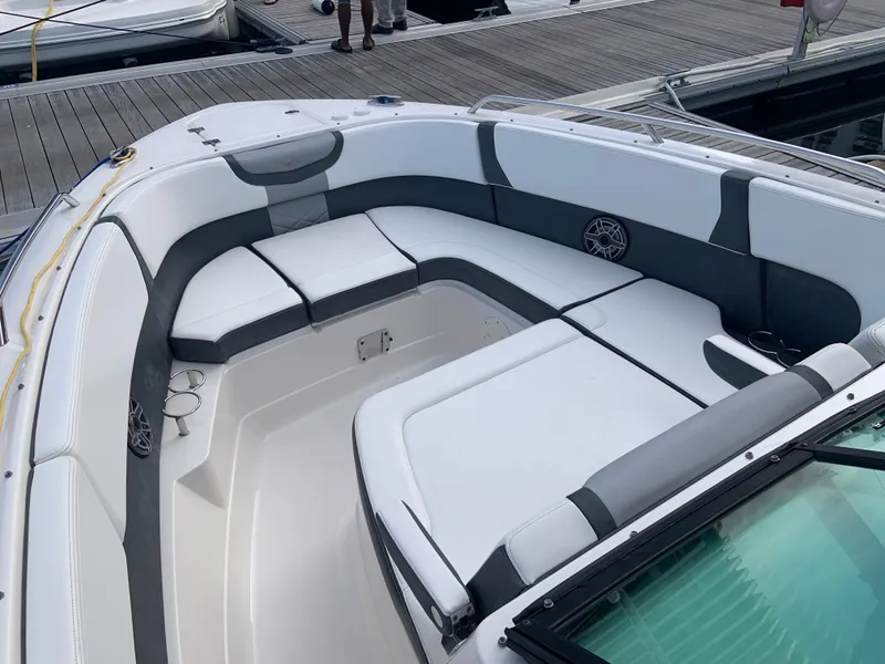 Slide: The Image of 2020 Chaparral 280 OSX boat with spacious seating area at the dock. - 28
