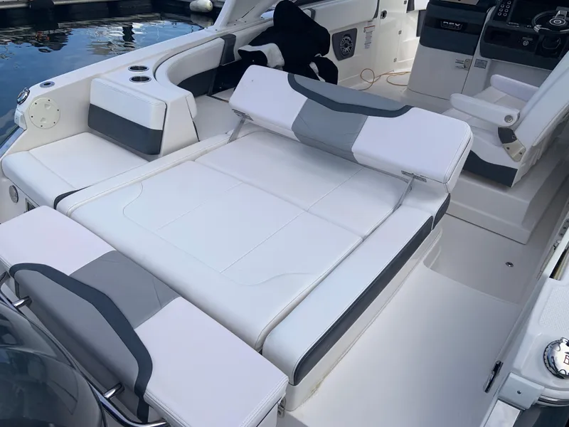 Slide: The Image of 2020 Chaparral 280 OSX boat interior with white and gray seating. - 7