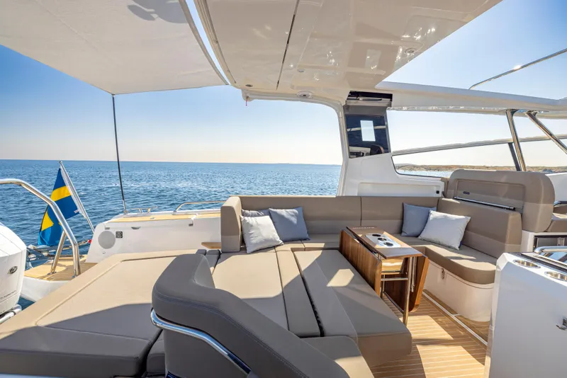 Slide: The Image of Luxurious Nimbus W11 2025 yacht interior with comfortable seating and ocean view. - 6