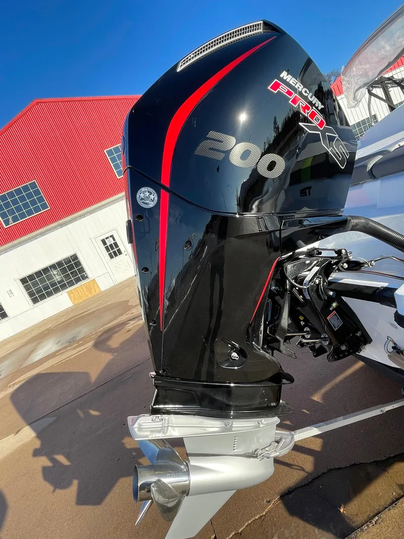 Slide: The Image of 2024 Tahoe T21 boat with Mercury 200 Pro XS outboard motor, red and black design. - 4