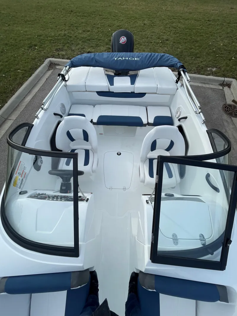 Slide: The Image of 2024 Tahoe 185 S boat with white and blue interior, open bow seating. - 3
