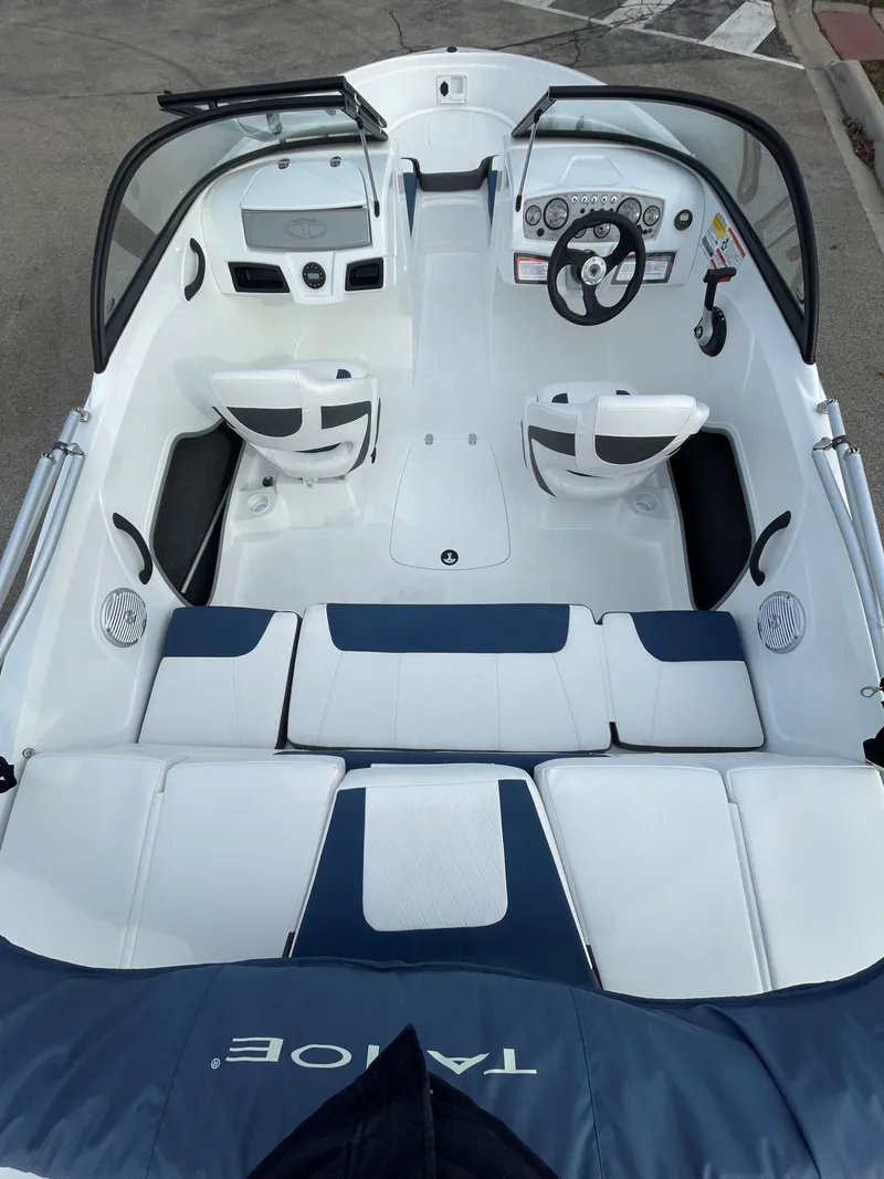 Slide: The Image of 2024 Tahoe 185 S boat interior with seating and steering wheel. - 4