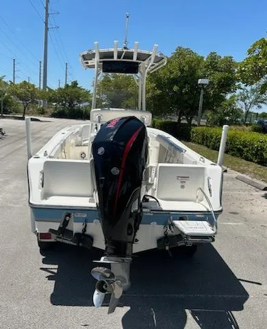 Slide: The Image of 2024 Mako 214 CC boat with outboard motor, rear view. - 4