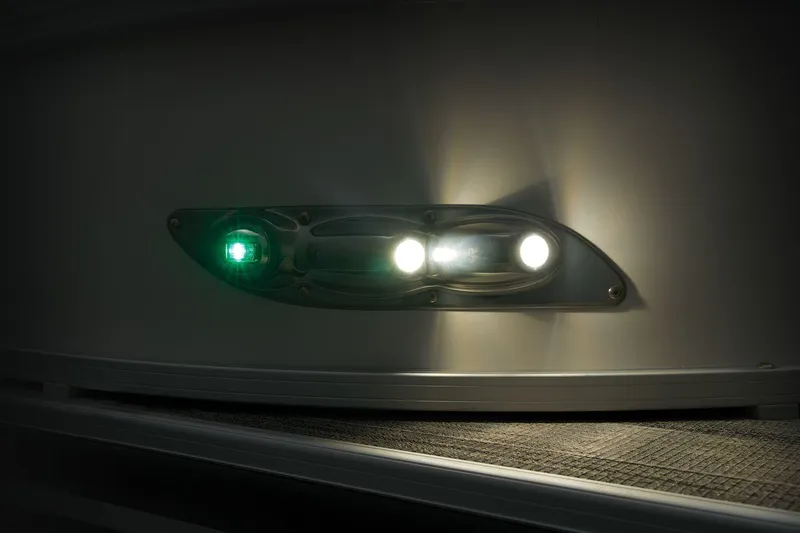 Slide: The Image of 2024 Ranger Reata 243C boat navigation lights at night. - 24