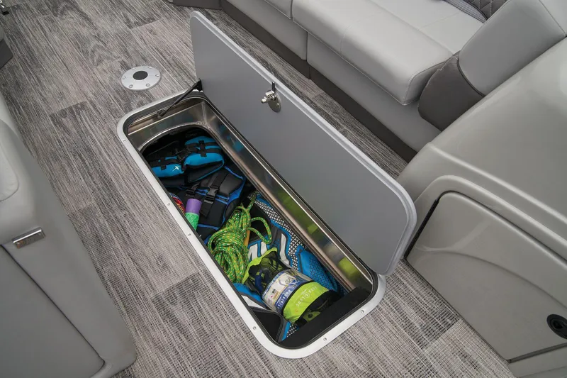 Slide: The Image of 2024 Ranger Reata 243C storage compartment with boating gear. - 37