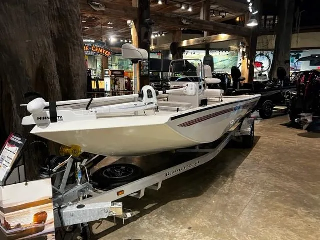 Slide: The Image of 2024 Ranger RB190 boat displayed indoors with modern design and sleek features. - 1